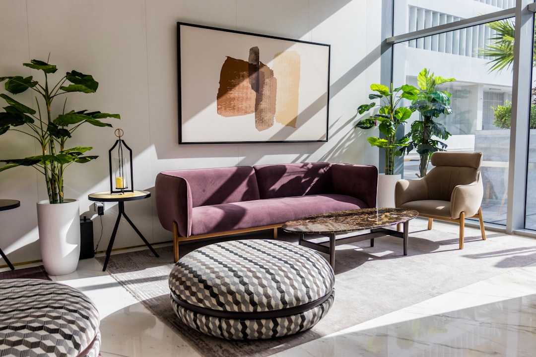 a-living-room-filled-with-furniture-and-a-large-window-w4t83gyvh58